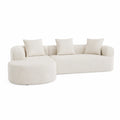 Divano angolare in tessuto beige con cuscini