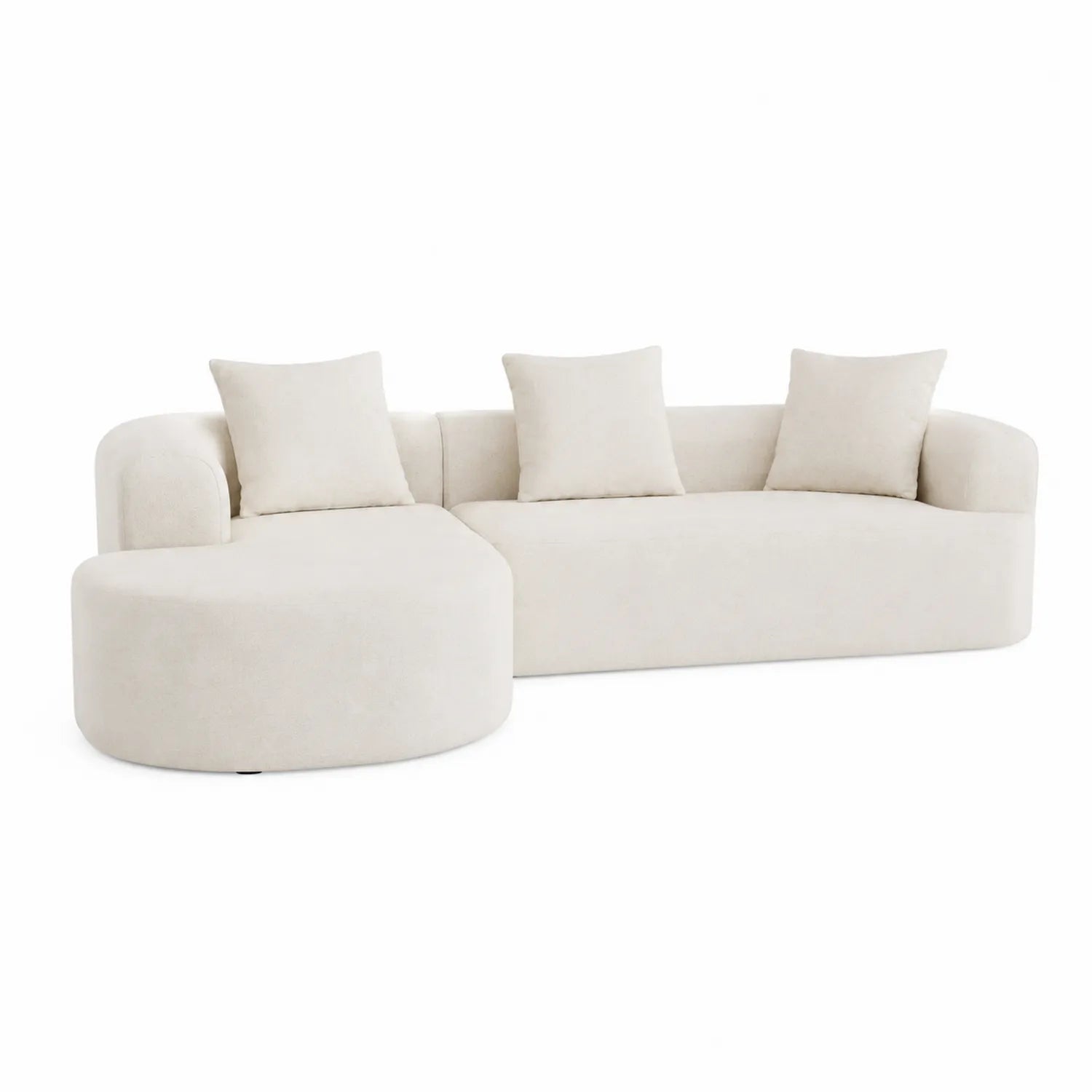 Divano angolare in tessuto beige con cuscini